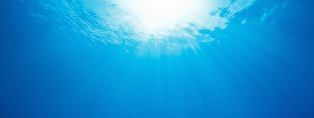 under water, abstract panorama of sun rays in the ocean